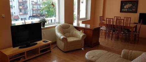 Living room with dining room and balcony