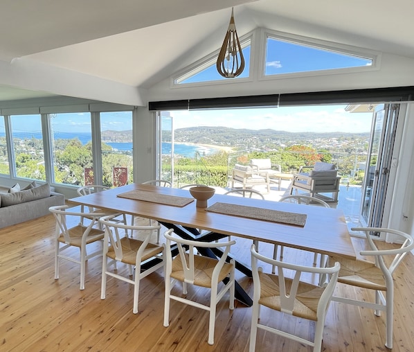 Front dining opening up to front alfresco entraining and beach views