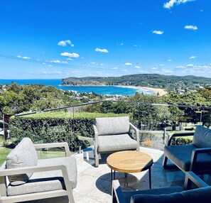 Alfresco entertaining overlooking Copacabana beach with coastal views to Sydney