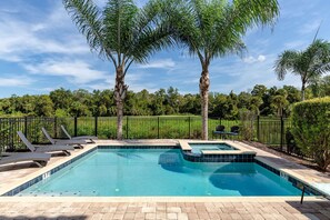 Admire the beautiful views of Reunion Resort as you cool off in your own private pool.