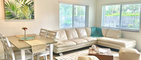 Comfortable open living room with spacious couch for everyone to lodge out after a fun filled day.