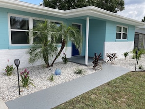 Front walkway has solar tiki torches.