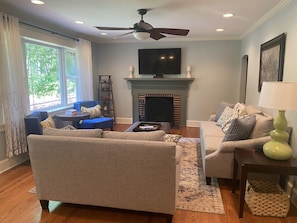 Family Room with fireplace and large bay window
