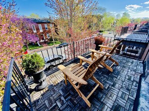 Relax on the front porch balcony with Adirondack chairs!