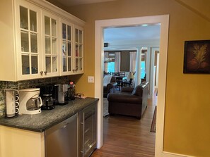 Coffee bar fit with Keurig, mugs, and even a wine fridge!