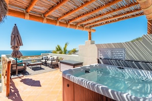 Enjoy the Hot Tub in the private rooftop terrace.