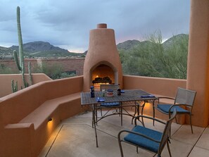 Outdoor dining with beehive fireplace, sunsets to the west