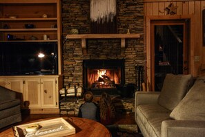 The fireplace attracts family member both young, and young at heart.
