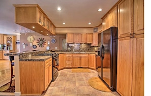 Large, bright kitchen with breakfast bar.