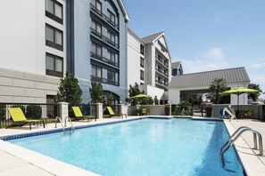 Swimming pool and poolside loungers