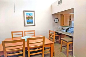 Dining area has bar stools for extra seating if needed.