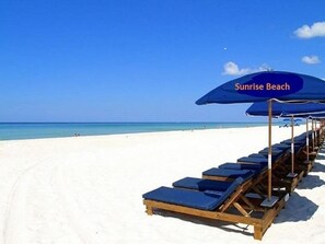 Relax on the white sands with complimentary Beach service included March - October