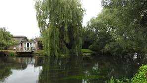 The studio from the opposite river bank