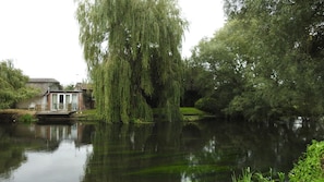 The studio from the opposite river bank