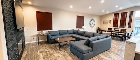 Open Concept Living area with a large sectional sofa with pull out bed