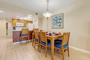 Dining for up to 8 with seating at the breakfast bar.