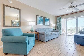 Living room features a sleeper sofa for two.
