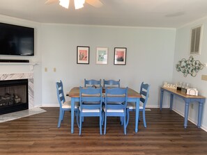 Our dining room seats six. A high chair can easily be attached to a chair.