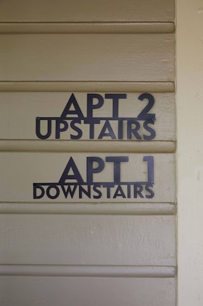 There are two apartments accessible from the front porch, apartment 1 (downstairs) and apartment 2 (upstairs).