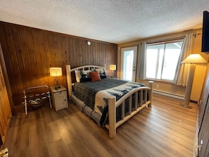 Elevation Vacation Rentals - The Yeti’s Den - 1st Floor Bedroom - Queen Bed + Patio Access