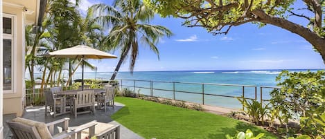 Oceanside lanai offers both lounge and table seating options.