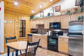 Kitchen with Dining Table and All Wood Cabinets