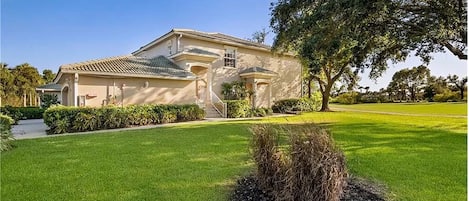 Front door, end unit, side view with large grass area