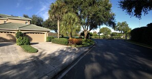 2 car garage and private driveway.  End unit. Sidewalk down right side.