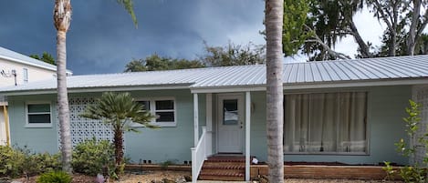 Front House- gravel yard, covered carport