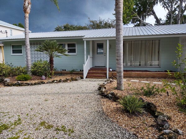 Front House- gravel yard, covered carport