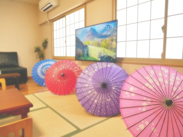 This is the living/dining room on the first floor. The interior is decorated with Japanese umbrellas.