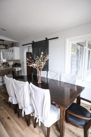 Dining room table that seats 8 with 2 stools at the kitchen bar top