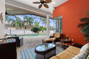 Enjoy the outdoors on the screened-in lanai’s cozy and covered lounge area. This is Island Living!