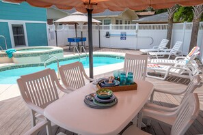 Covered table on private pool deck for refreshing lunches and dinners 