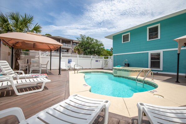 Sunrise Retreat private pool deck with clean pool, hot tub, & plenty of sunshine