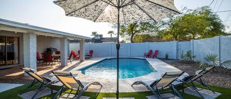 A private, backyard haven with sparkling swimming pool