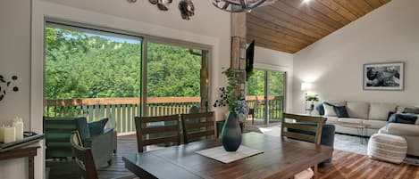 Dining and living room both with beautiful lake views.