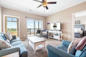 Comfortable Living Room with Sunroom and Private, Covered Balcony Access, Cable TV/DVD, and a Sofa Bed