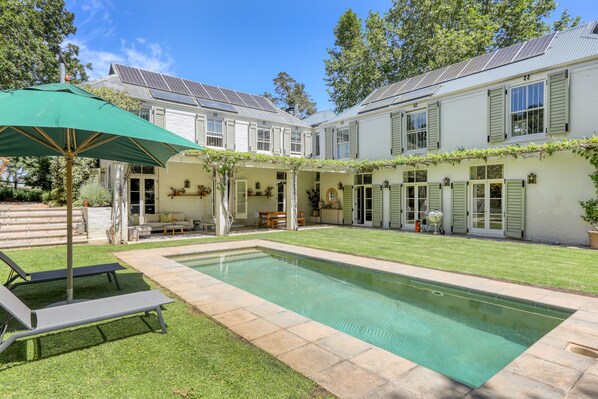 Stunning 6 bedroom farm styled house with large pool and rolling lawns.