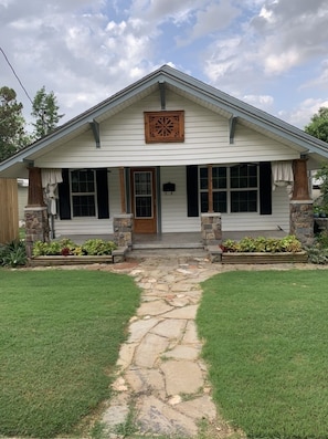 Front of the house with rock walkway and Bermuda grass