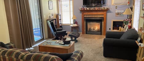 Living room, attractive natural gas fireplace.