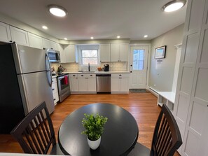 Private rear entry with 2 parking spots directly off of the kitchen.