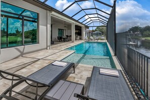 HUGE POOL DECK WITH PICTURE SCREEN