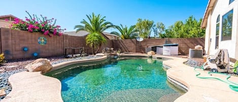 Private backyard with swimming pool, BBQ, and outdoor patio. Pool Heating optional,  fee required 