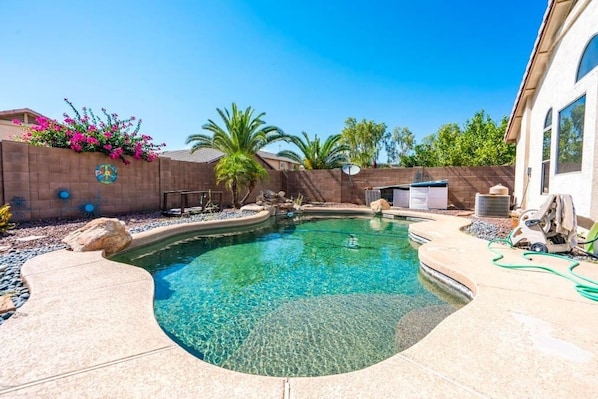 Private backyard with swimming pool, BBQ, and outdoor patio. Pool Heating optional,  fee required 
