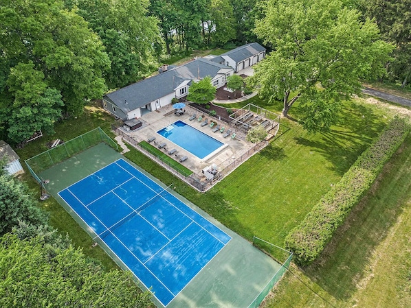 The estate features a private large, newly refinished tennis court.