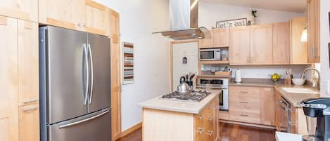 Beautifully remodeled kitchen with custom Maple cabinetry & new appliances