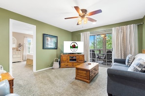 Living Area with Cable TV and Sunroom Access