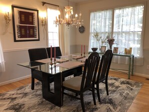 Formal dining room. Black laquer table with glass top and seating for six. 