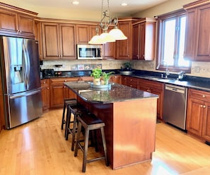 Kitchen with new stainless appliances, double oven